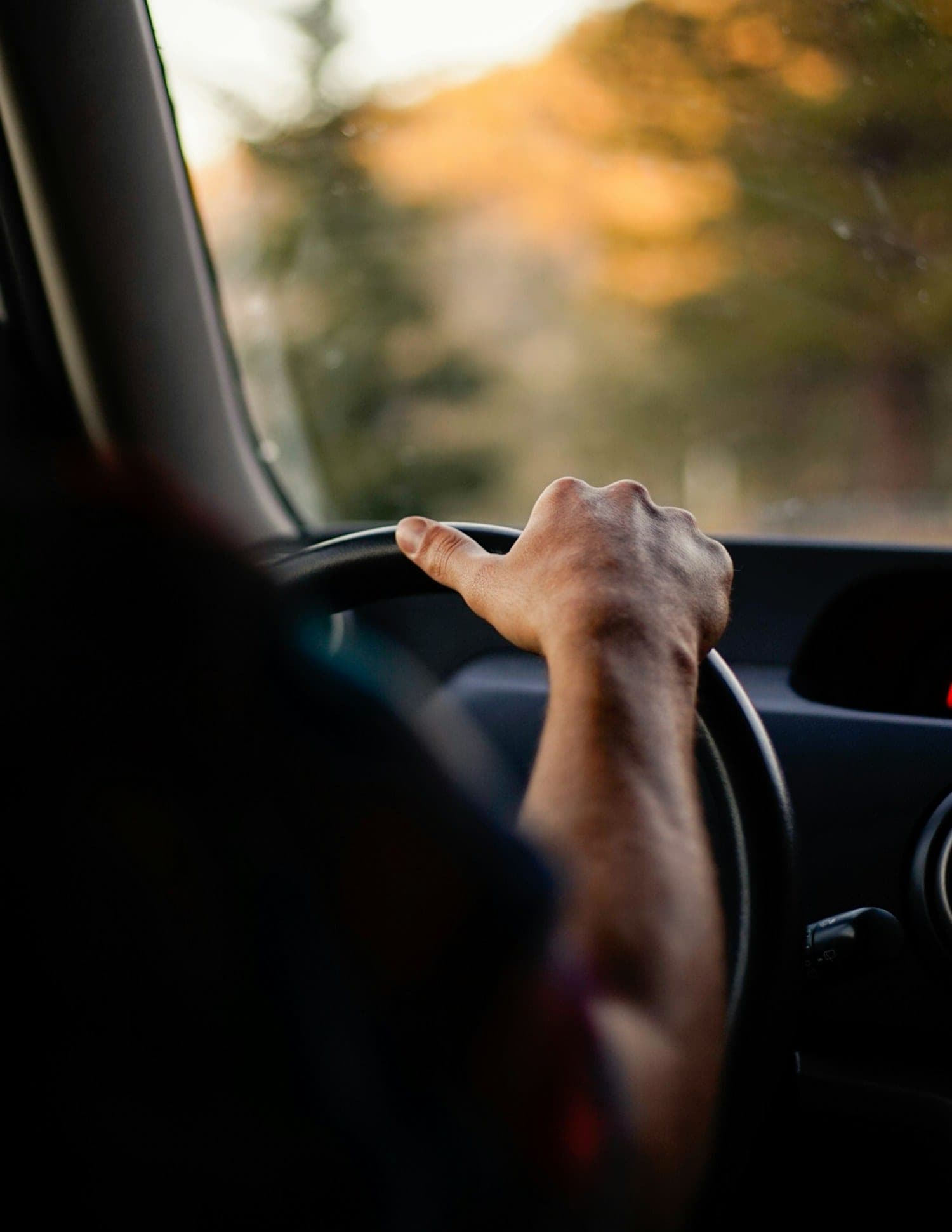 On a test drive Driver's hand resting on the steering wheel during a drive